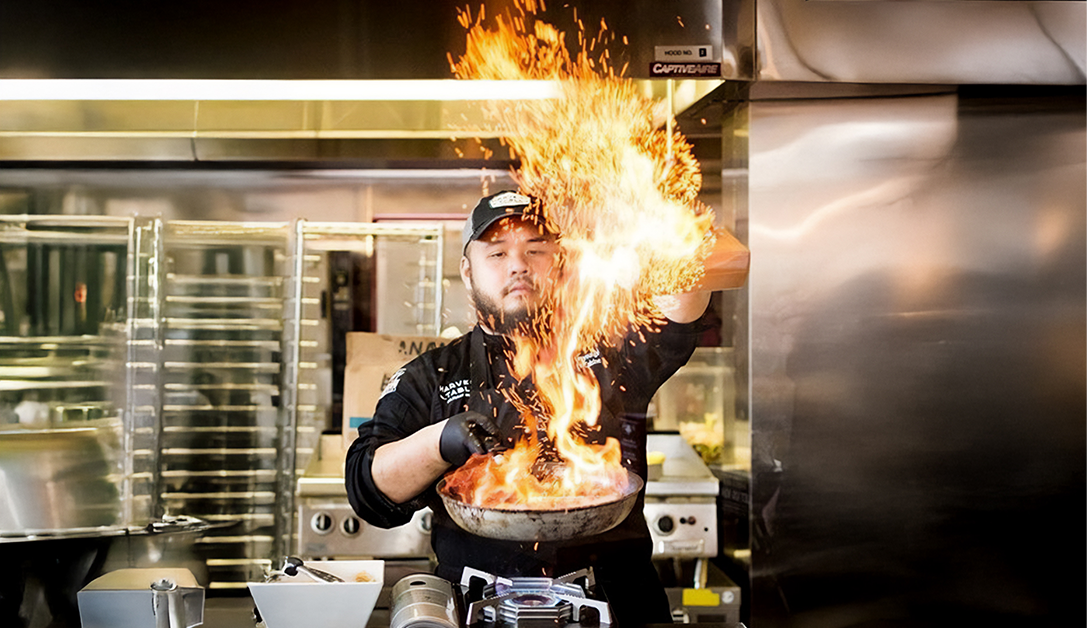 Chef Danny cooking over flame